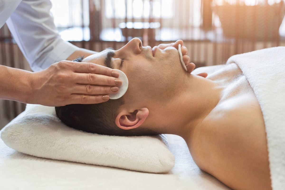 Aesthetician performing a medical facial treatment for a Tampa, FL client at Fusion Medispa